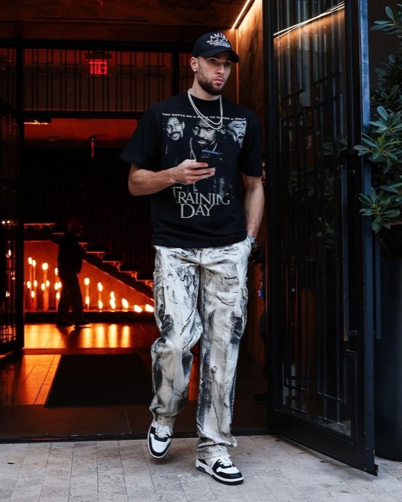 Talent photographed wearing a graphic tee from the programs, photo 18 of 23
