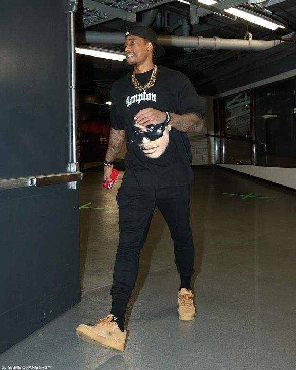 Talent photographed wearing a graphic tee from the programs, photo 13 of 23