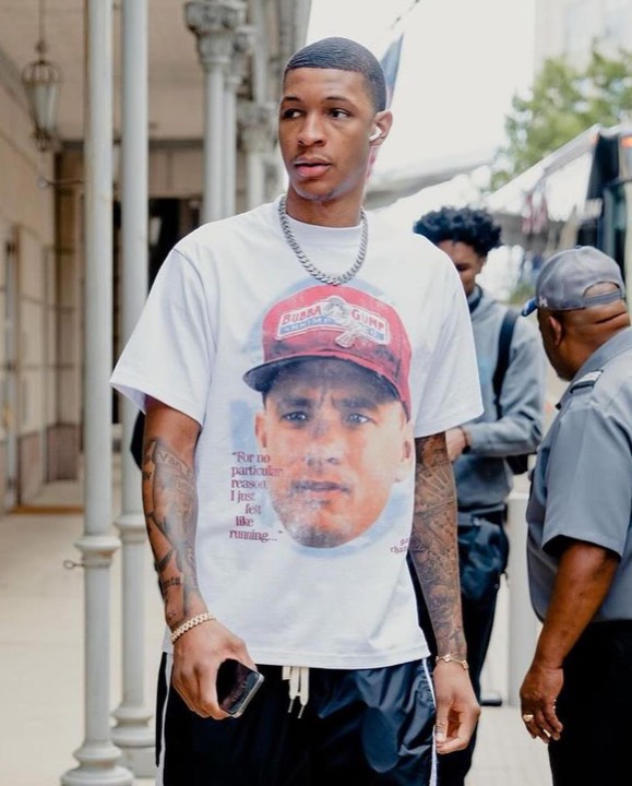 Talent photographed wearing a graphic tee from the programs, photo 4 of 23