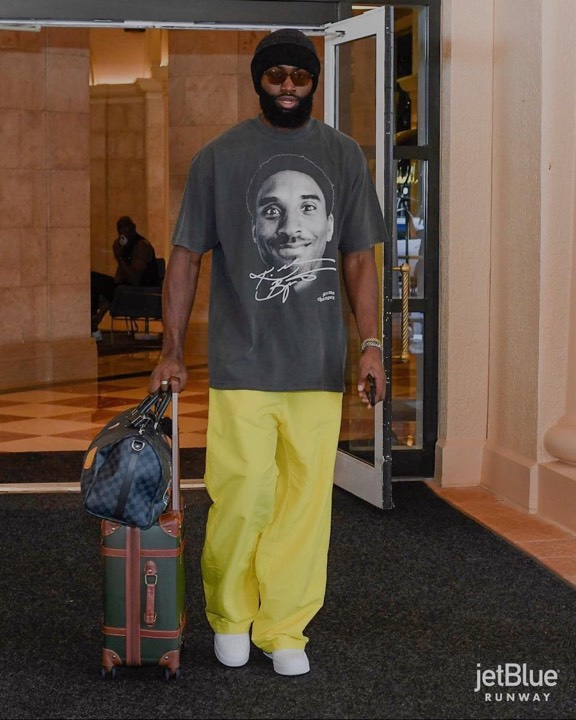 Talent photographed wearing a graphic tee from the programs, photo 9 of 23